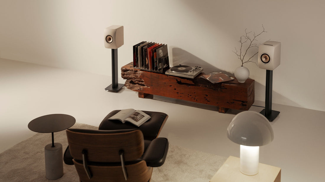 Modern living room with a chair, table,  decorative items & LS5O Wireless II mounted to a S2 Floor stand